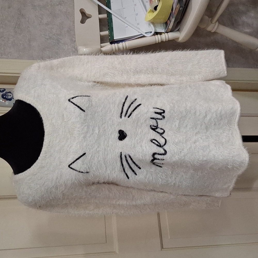 "H&M, SZ. S/M, Soft and fuzzy," Cat Meow" sweater. Acrylic and polyester.